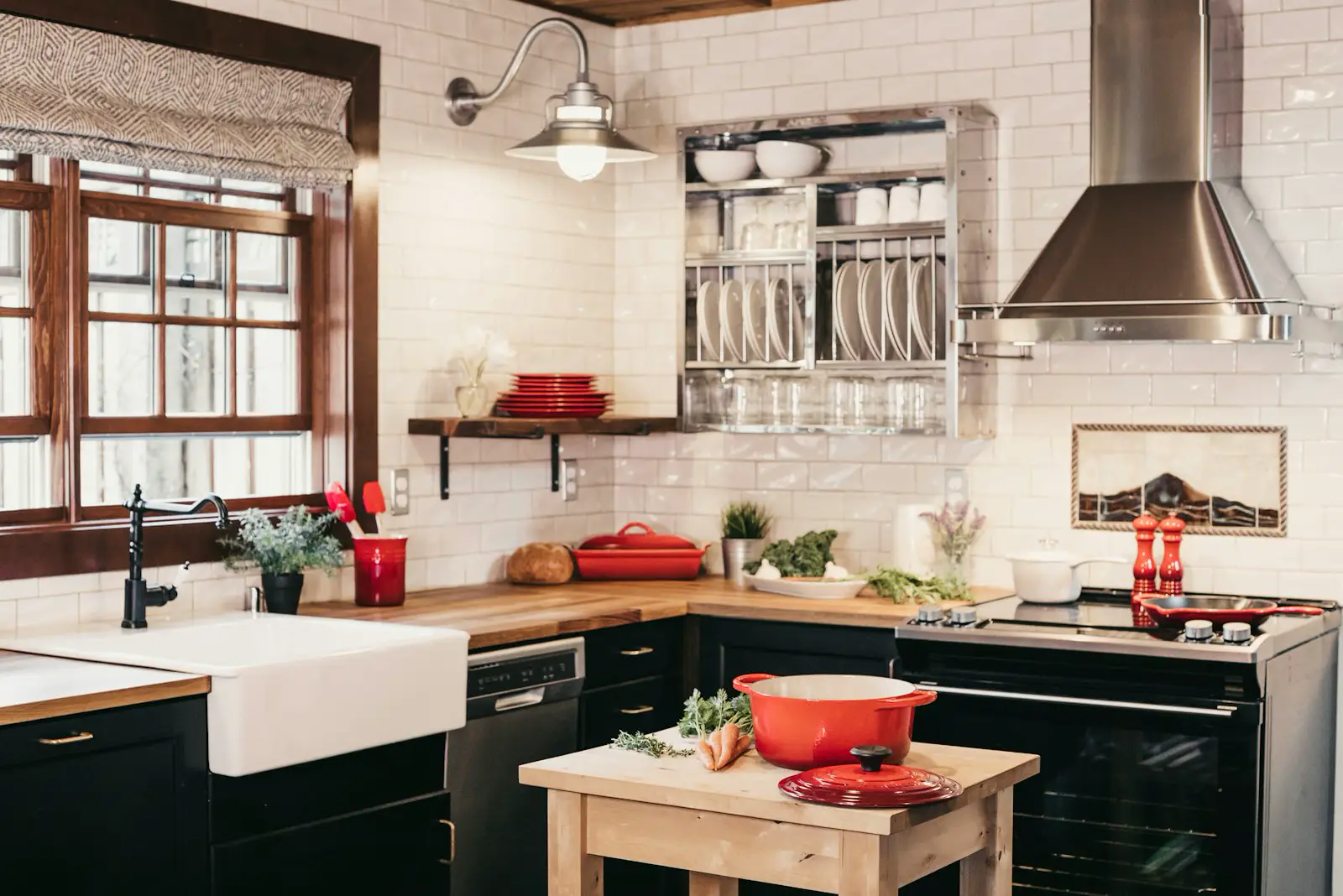Black cabinets, wood counters, and a farmhouse sink. Shown on the homepage for Rockford, IL.